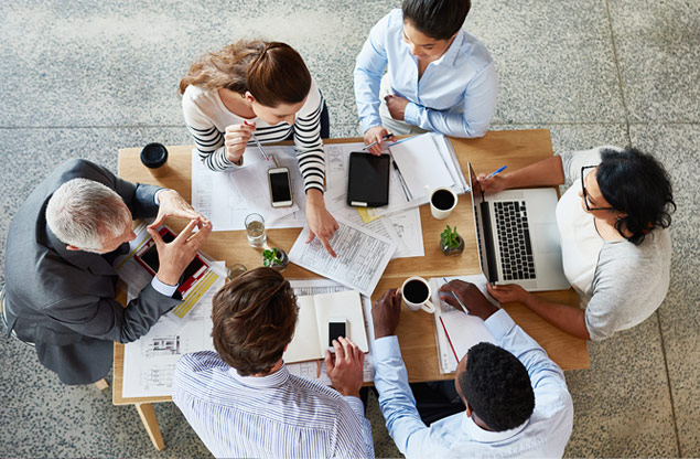 Group of employees discussing work